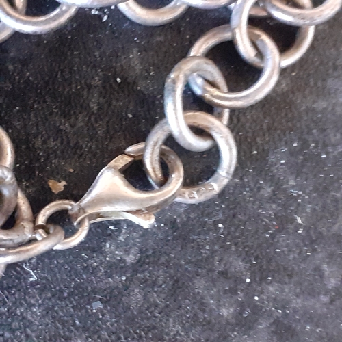 93 - Sterling silver chain link style bracelet with heart shaped pendant. Weight approx 20.3g