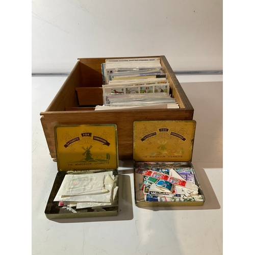 117 - A large collection of first day covers and 2 tins of postage stamps some unfranked