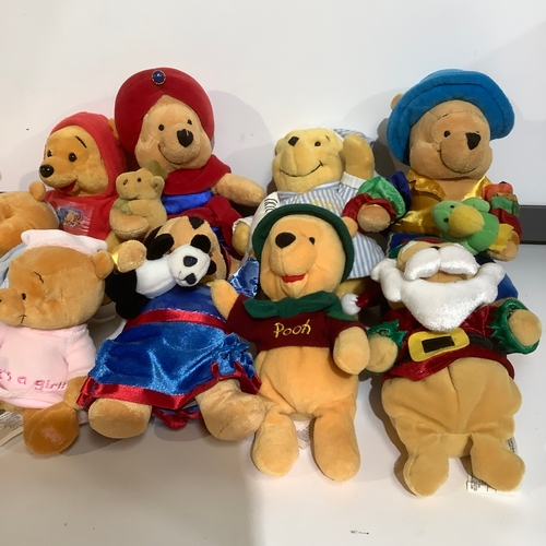 268 - 11 Disneyland resort Pooh bears includes 2002 bear