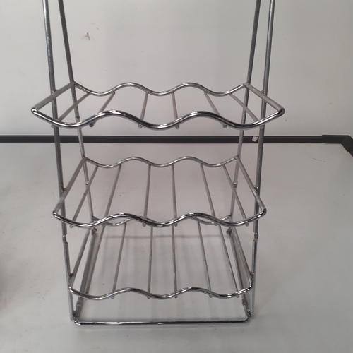 25 - 2 x stainless steel wine racks. Overall good condition