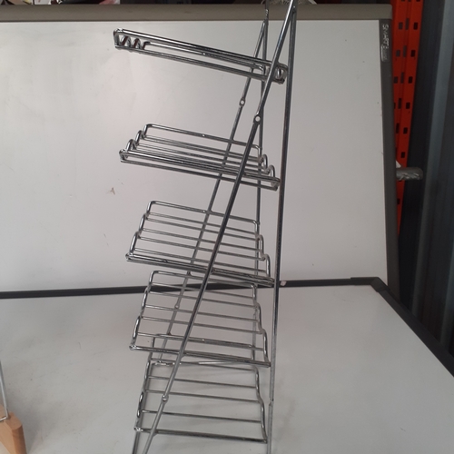 25 - 2 x stainless steel wine racks. Overall good condition