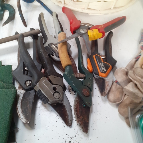 18 - Gardening lot. Includes several pairs of secateurs, tools, a wicker type planter, quantity of sandpa... 