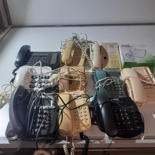 21 - Large quantity of push button telephones, some with answerphones. Includes Panasonic KX-NT553, Audio... 