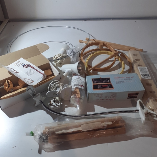 22 - A good sized lot of crafting equipment. Includes frames, feame holders and clamps, lighting, tool ki... 