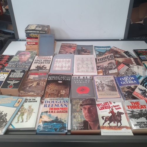 31 - A large quantity of war and forces related books. Some well known sought after reading material, bot... 