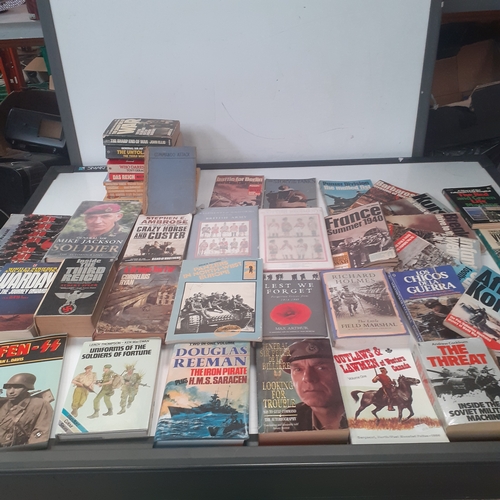 31 - A large quantity of war and forces related books. Some well known sought after reading material, bot... 