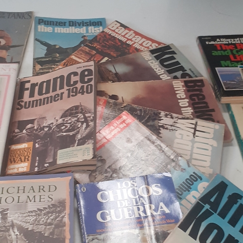 31 - A large quantity of war and forces related books. Some well known sought after reading material, bot... 