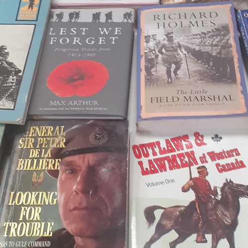 31 - A large quantity of war and forces related books. Some well known sought after reading material, bot... 