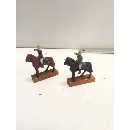 44 - Lead British cavalry toy soldiers on wooden bases