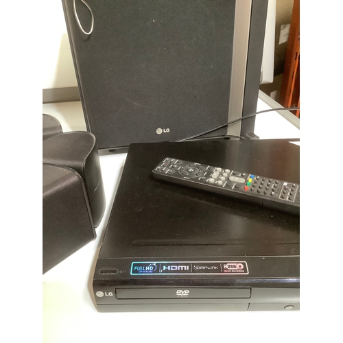 255 - LG DVD player home cinema with remote & speakers power tested