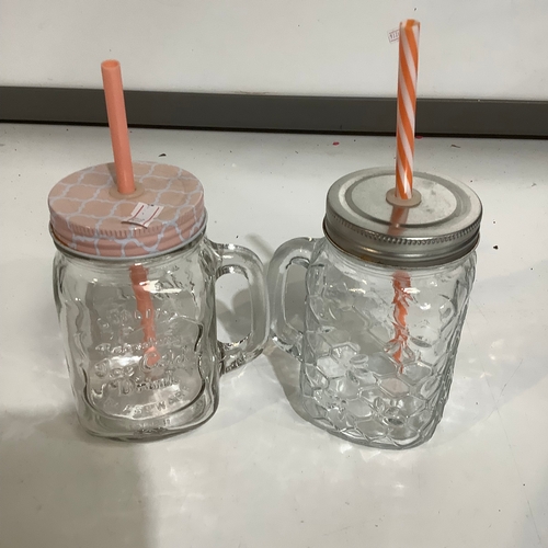 274 - Pair of glass lidded drinking jars