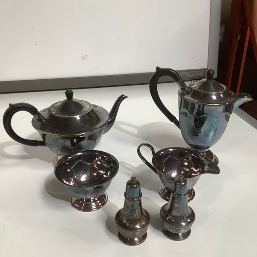 68 - Silver plate tea & coffee pot, cruet set & milk jug