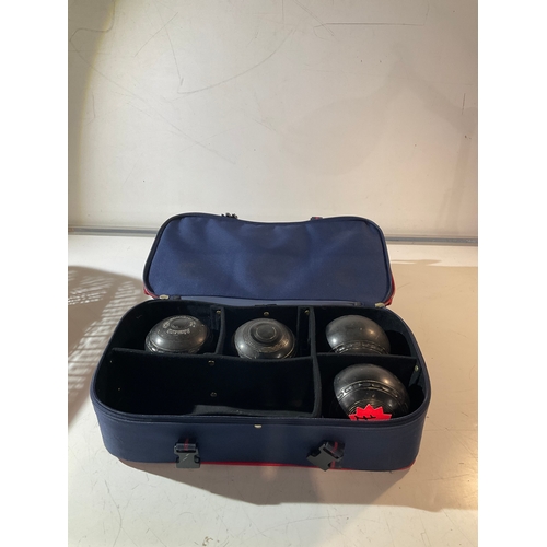 187A - Henselite bag with a set of 4 lawn green bowling woods