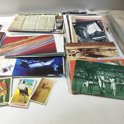 44 - Large collection of different postcards & tea cards