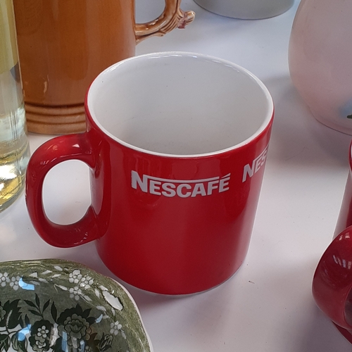 18 - Mixed lot of crockery, ornamental and decorative items, some collectible. Includes Nescafe mugs and ... 