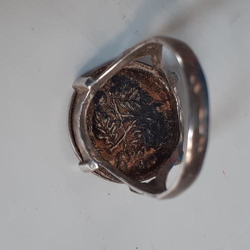 19A - Sterling silver ring encasing a threepenny bit. Size N. 3.4g. Nice detail but would benefit a clean