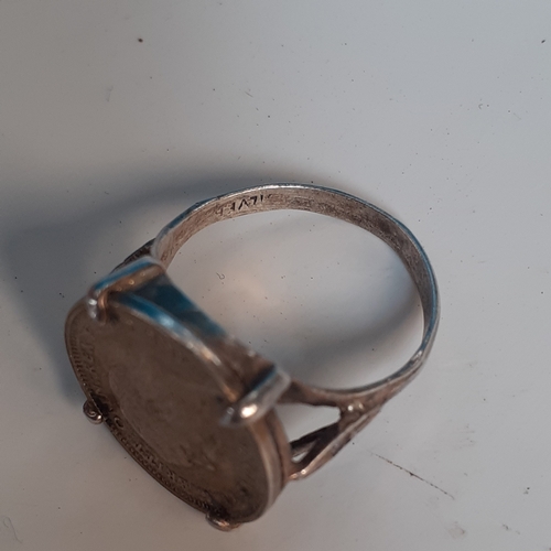 19A - Sterling silver ring encasing a threepenny bit. Size N. 3.4g. Nice detail but would benefit a clean