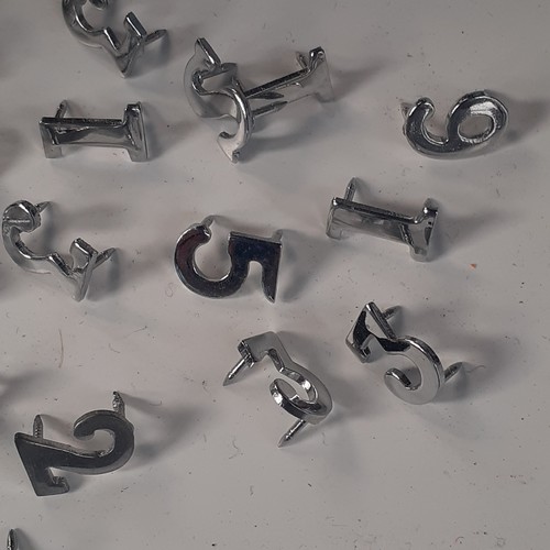 36 - Quantity of metal number pin badges used for Police shoulder numbers. With pins. Random numbers in g... 