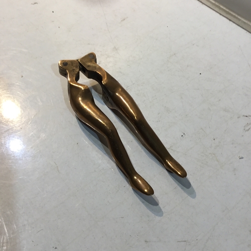 18 - Novelty solid brass nut cracker in shape of a woman's pair of legs