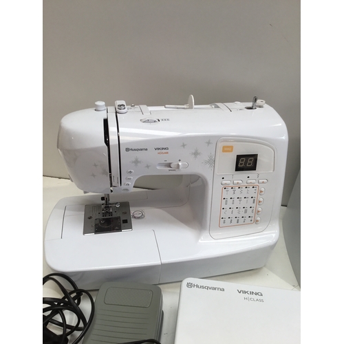 109 - Husqvarna H Class 100Q sewing machine with case & extension table in working order