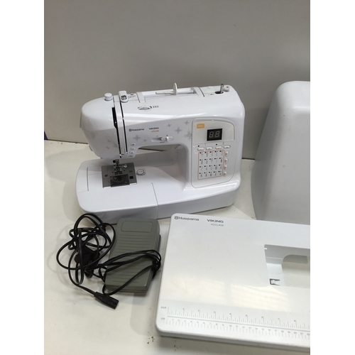 109 - Husqvarna H Class 100Q sewing machine with case & extension table in working order