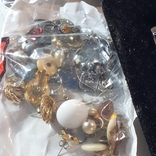 8 - Modern jewellery lot. Includes never worn watches, a mix of earrings possibly odd/broken, bracelets,... 