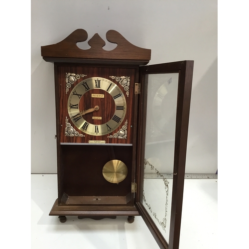 298 - President Quartz wall hanging clock in good clean condition