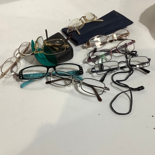 346 - Quantity of reading glasses. Some with cases. Worn, but overall no damage.