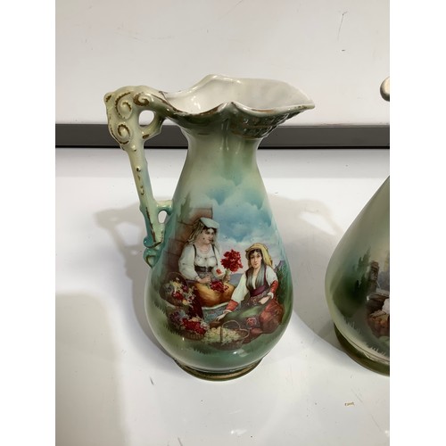 76 - Pair of painted matching jugs