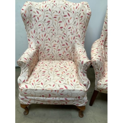 404 - Pair of matching wing back armchairs