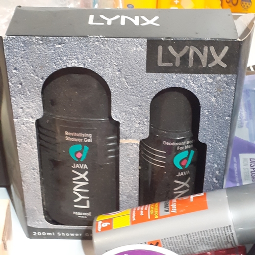 27 - Large lot of smellies and beauty products. Includes new Lynx, multiple sun tan lotions of which some... 