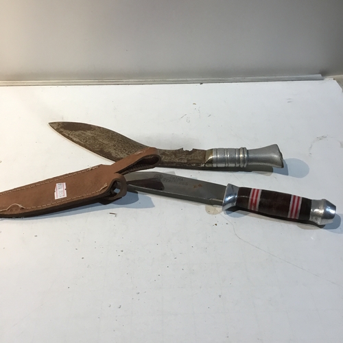 56 - China stainless & one other engraved blades