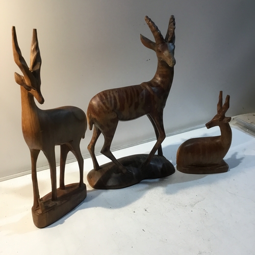 85 - Trio of wooden antelope ornaments