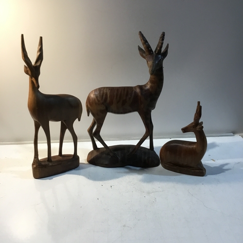 85 - Trio of wooden antelope ornaments