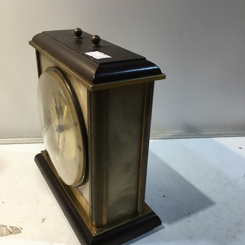 109 - Metamec brass and onyx cased battery operated mantle clock