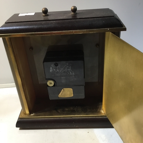 109 - Metamec brass and onyx cased battery operated mantle clock