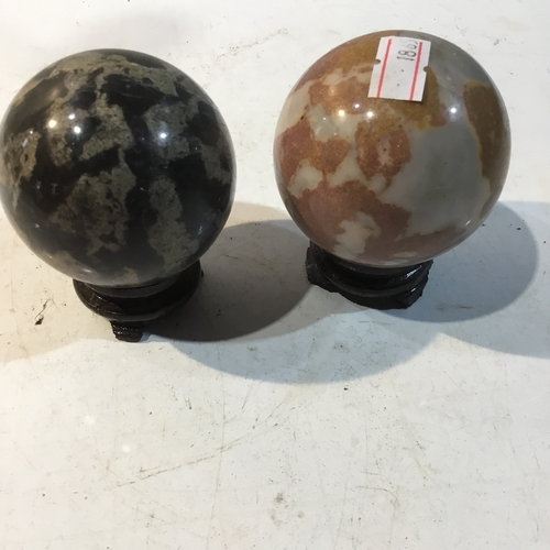 116 - Miniature onyx marble style globes on plinths