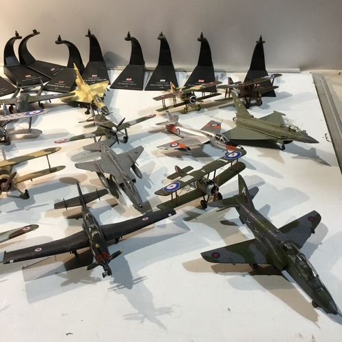 131 - Large quantity of metal war time plane ornaments - some with stands