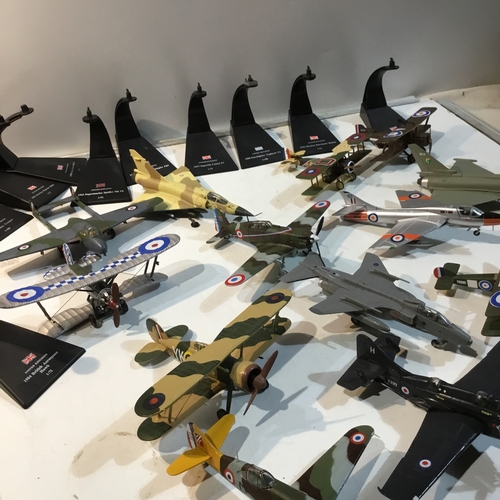 131 - Large quantity of metal war time plane ornaments - some with stands