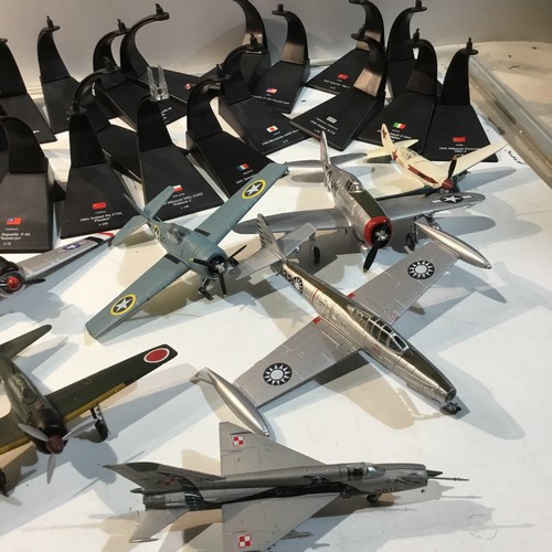 126 - Large quantity of metal war time planes - some with stands