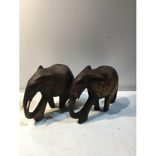 149 - Pair of wooden elephant ornaments