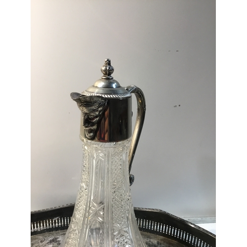 155A - Cut glass decanter depicting face on spout with a Silver plated tray