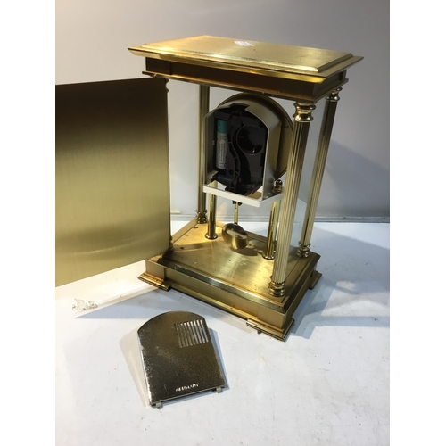 168 - Benchmark brass cased heavy battery operated mantle clock