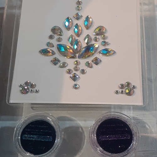 11 - 4 boxes of face glitter and face jewel sets as new.