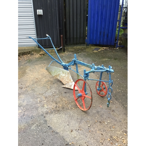 478 - Vintage Cooke manual push along plough - painted - wheels still move - approx 10ft long