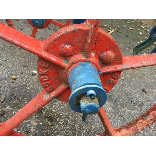 478 - Vintage Cooke manual push along plough - painted - wheels still move - approx 10ft long