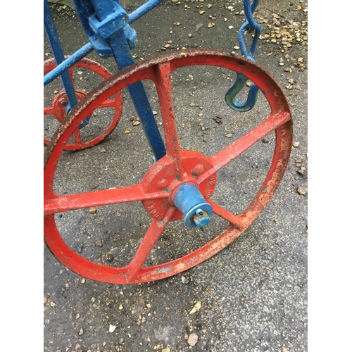 478 - Vintage Cooke manual push along plough - painted - wheels still move - approx 10ft long