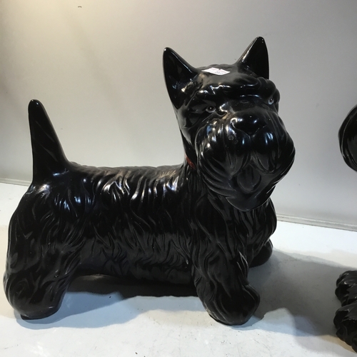 177 - Pair of black ceramic Scottish terrier dogs - one is a biscuit barrel