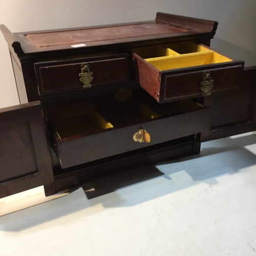 182 - Mahogany effect jewellery box with brass clasped detail