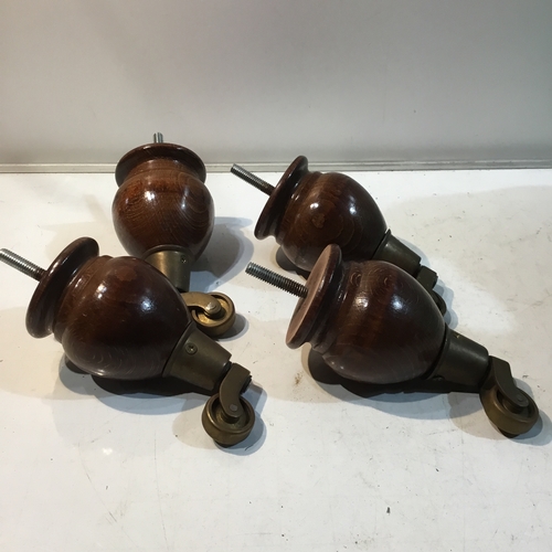 188 - Set of 4 wood and brass based castors